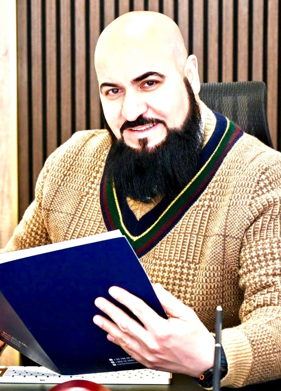 Salam Albadi at his office reviewing case documents